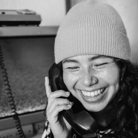 Lady on phone for bookings BW