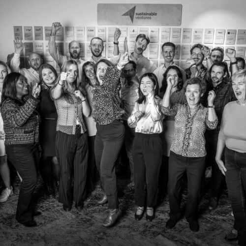 Team staff happy punching air BW
