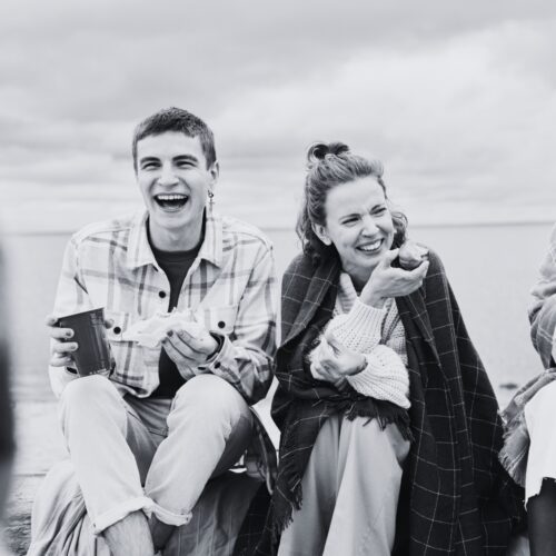 Our people shaped support B&W two people laughing