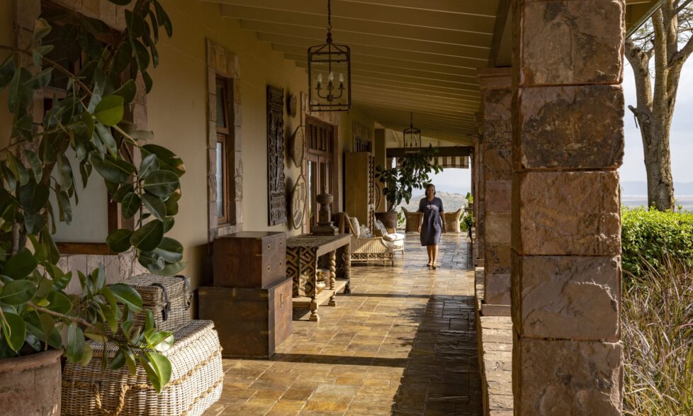 Singita Sasakwa Lodge Staff On Verandah